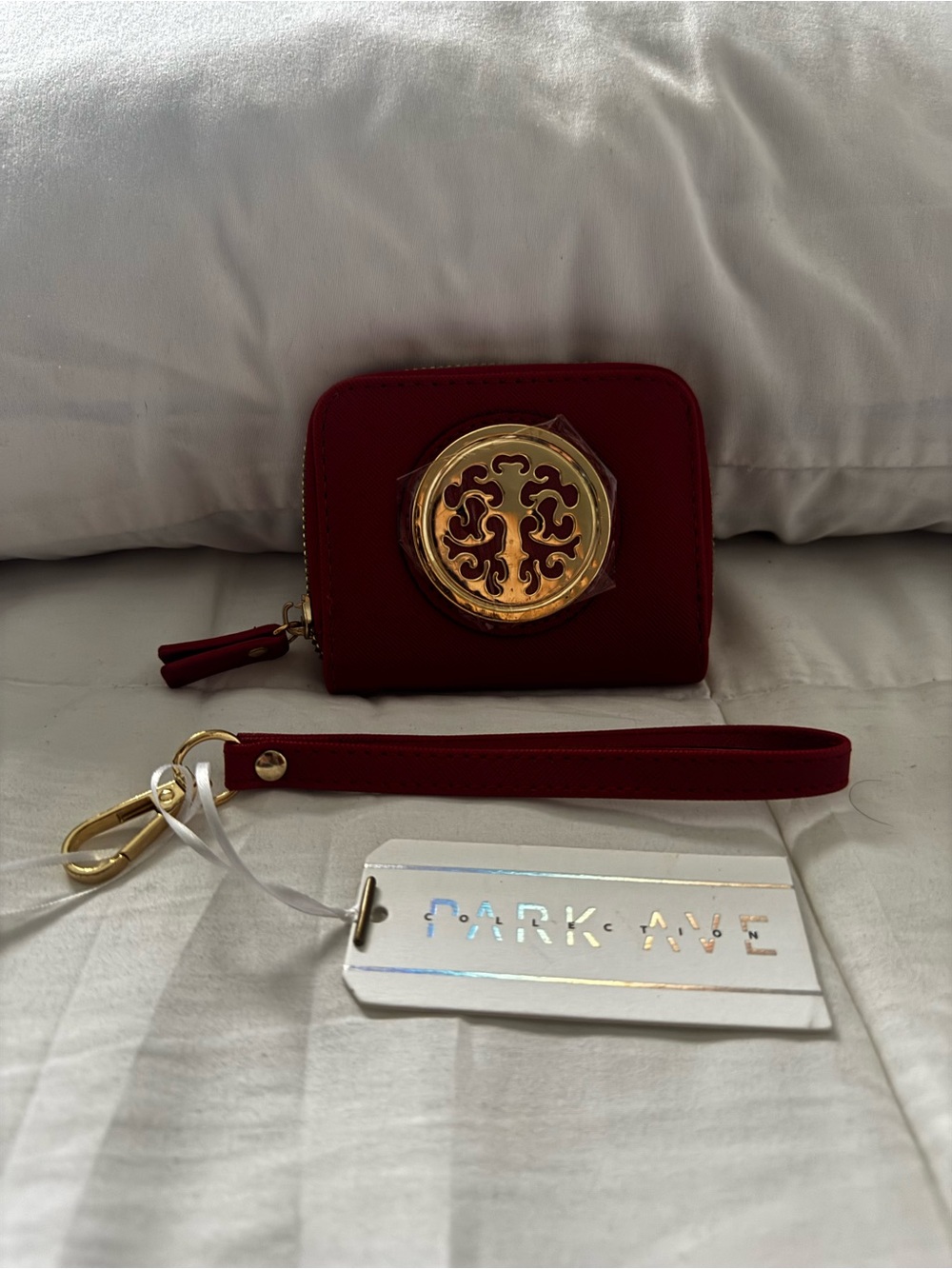 NWT- Park Lane mini Red Wristlet Clutch with Gold Medallion.